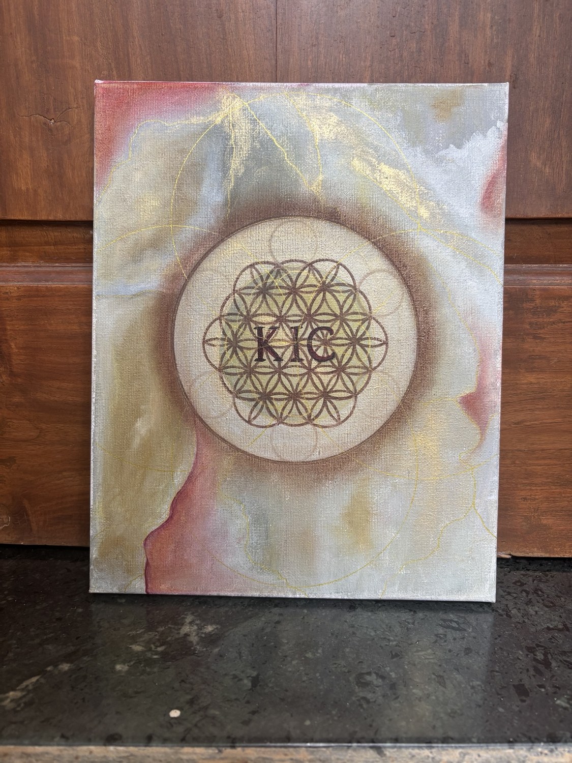 Abstract painting with sacred geometry and a central flower of life motif