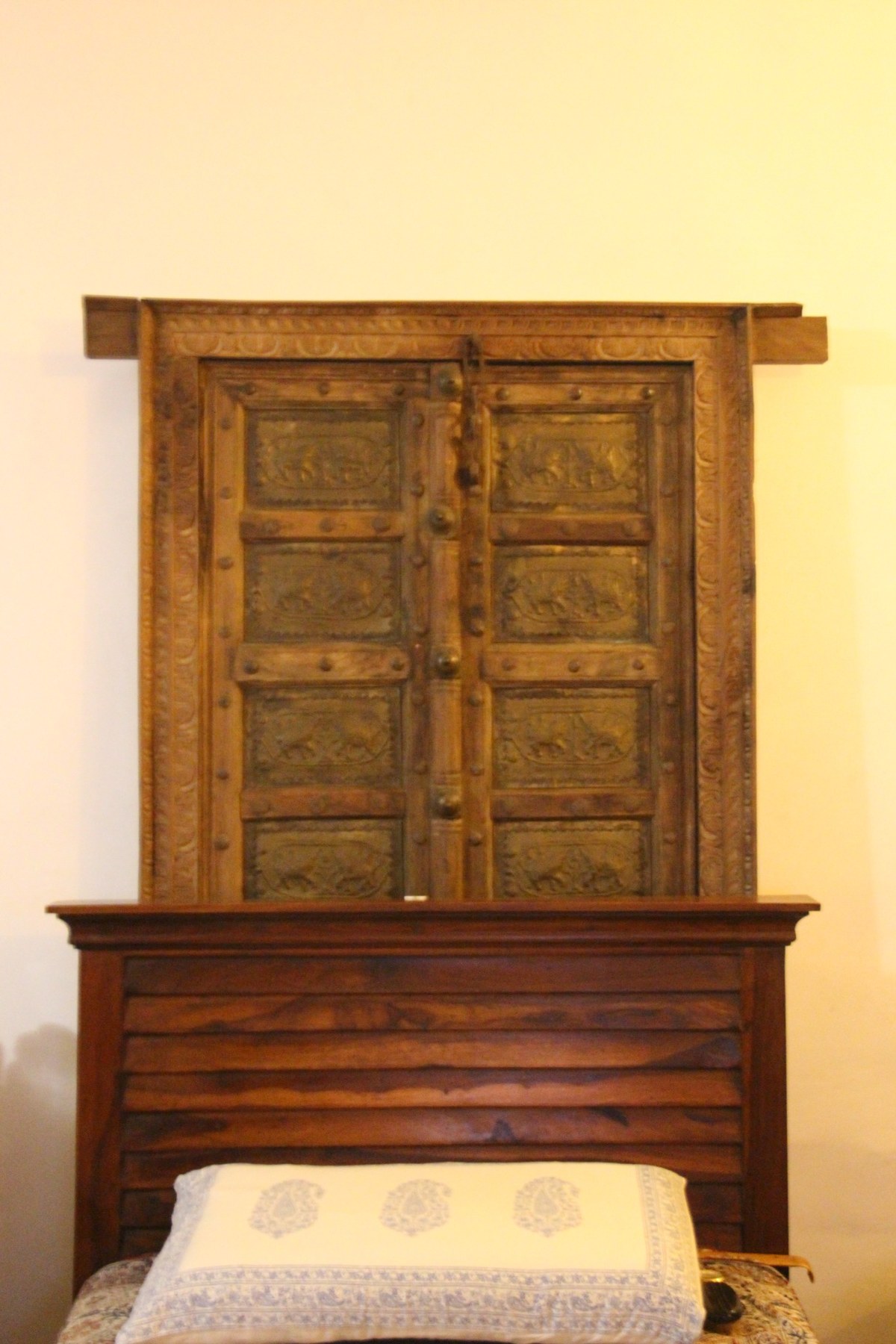 Carved timber headboard at Bluebird Homestead
